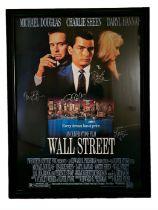 Wall Street 1987 movie poster framed and signed by Michael Douglas, Charlie Sheen, Daryl Hannah