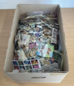 A Large Box of unsorted Worldwide Stamps containing Bags, approx size of box in Inches 19 length, 13
