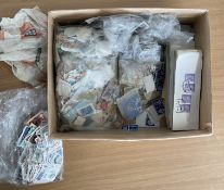 A Small Box of unsorted Worldwide Stamps containing Bags, hundreds of strips of larger envelopes