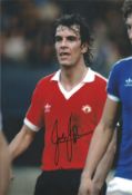 Joe Jordan signed 12x8 inch colour photo pictured while playing for Manchester United. Good