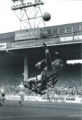 Joe Corrigan signed 12x8 inch vintage black and white photo pictured in action for Manchester