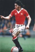 Mickey Thomas signed 12x8 inch colour photo pictured in action for Manchester United. Good