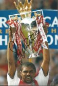 Nwankwo Kanu signed 12x8 inch colour photo pictured in action for Arsenal. Good condition. All