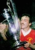 Alan Kennedy signed 12x8 inch colour photo pictured celebrating with the European Cup. Good