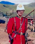 Michael Caine signed 10x8 inch Zulu colour photo. Good condition. All autographs come with a