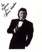 Johnny Mathis signed 10x8 inch black and white photo dedicated. Good condition. All autographs