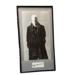 Kiefer Sutherland mounted signature with black and white photo from the movie The Lost Boys.