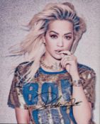 Rita Ora signed 10x8 inch colour photo. Good condition. All autographs come with a Certificate of