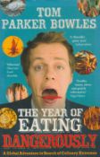 Tom Parker Bowles signed paperback book titled The year of Eating Dangerously, signature on the