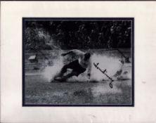 Tom Finney signed black and white splashdown photo. Mounted to approx size 14x12inch. Good