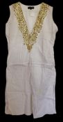 Paris Hilton owned White tunic dress with gold trim has accompanying images of Hilton wearing the
