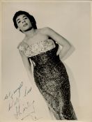 Shirley Bassey signed 9x7 inch original black and white photo dedicated. Good condition. All