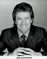 Jim Davidson signed 10x8 inch black and white promo photo. Good condition. All autographs come