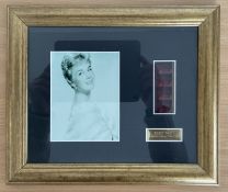 Doris Day limited edition film cell, mounted and framed with black and white photo. Approx overall