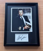 Alec Baldwin signed colour photo in frame with signature below. Measures 17"x13" appx. Good