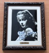 Hedy Lamarr signed black and white photo framed. With gold name plaque below. Measures 12"x14"appx..