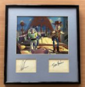 Tom Hanks and Tim Allen signed Toy Story Buzz Lightyear and Woody framed colour photo with