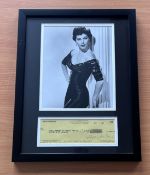 Ava Gardner framed signed cheque for $100.00 Dated June 65 and black and white photo of Ava above.