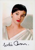 Leslie Caron signed 8.5x6 inch colour promo photo. Good condition. All autographs come with a