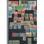 Worldwide Stamps in a Stockbook with some loose pages Includes Bermuda Block of Four Mint Coronation