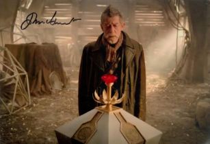 John Hurt signed 10x8 inch Doctor Who colour photo. Good condition. All autographs come with a