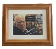 Patrick Moore signed 14x12 inch overall mounted and framed Dr Who colour photo. Good condition.
