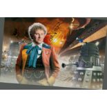 Colin Baker signed 12x8 inch Doctor Who colour photo. Good condition. All autographs come with a