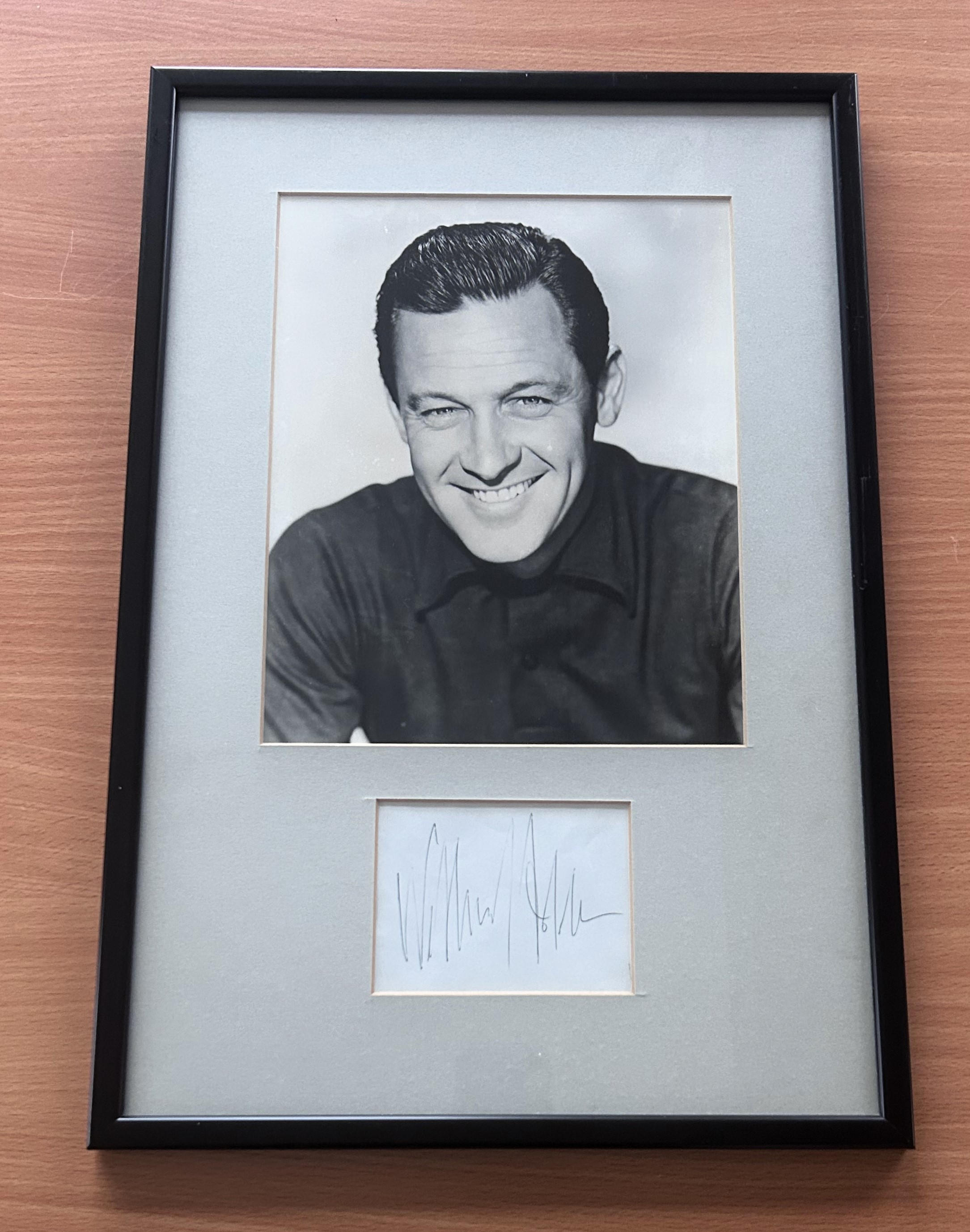 William Holden signed mounted and framed black and white photo with signature below. Good condition.