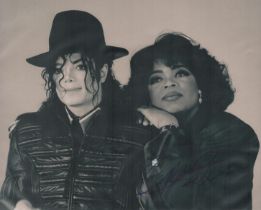 Oprah Winfrey signed black & white photo taken with Michael Jackson unsigned 10x8 Inch. Is an