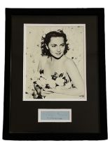 Olivia De Havilland signed and framed black and white photo. Measures 17x13 appx. Good condition.
