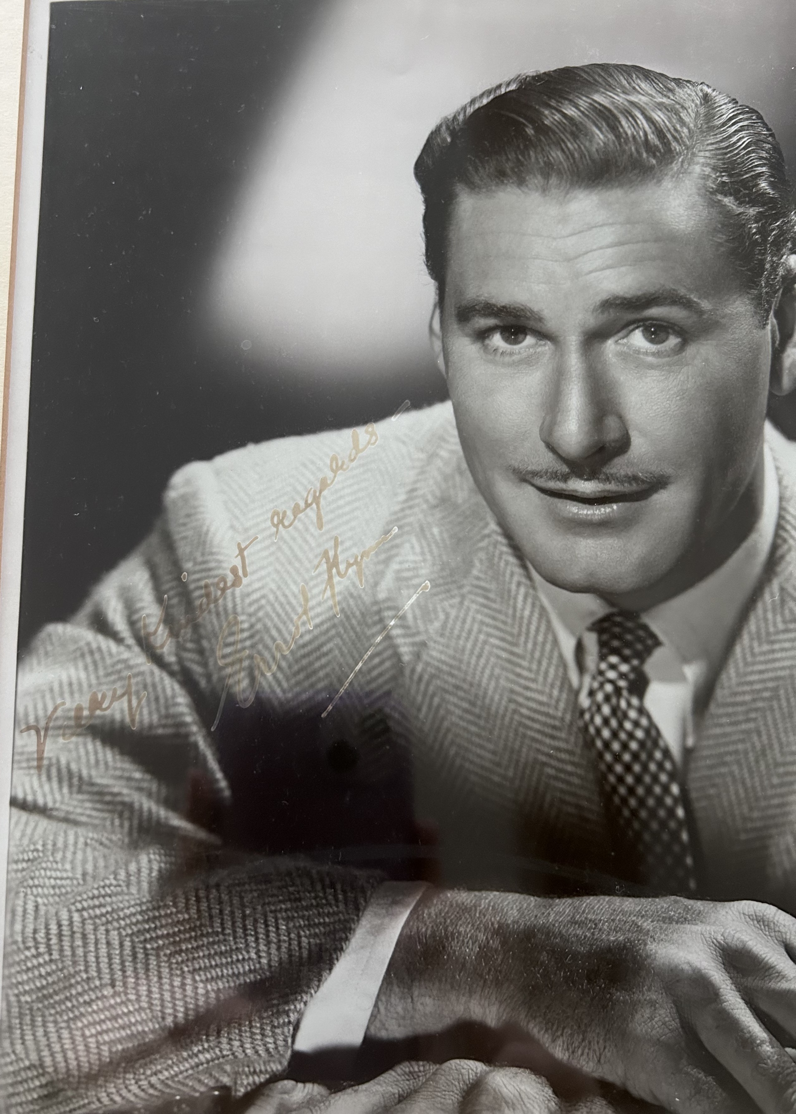 Errol Flynn signed mounted and framed black and white photo, with gold name plaque below. Measures - Image 2 of 2