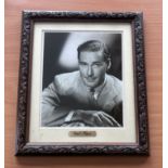 Errol Flynn signed mounted and framed black and white photo, with gold name plaque below. Measures