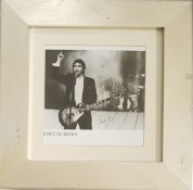 Chris De Burgh signed black and white photo. Mounted and framed to approx. size 14x14inch. Scratches