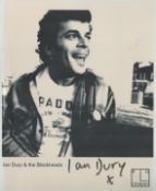 Ian Dury signed promo black & white photo. Was an English singer, songwriter and actor who rose to