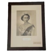 Queen Elizabeth II signature piece and Dorothy Wilding signature piece mounted below black and white
