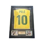 Pele signed Brasil shirt. Mounted and framed with name plaque and 2 small colour photos. Approx