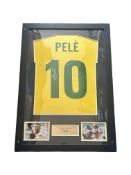 Pele signed Brasil shirt. Mounted and framed with name plaque and 2 small colour photos. Approx