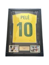 Pele signed Brasil shirt. Mounted and framed with name plaque and 2 small colour photos. Approx