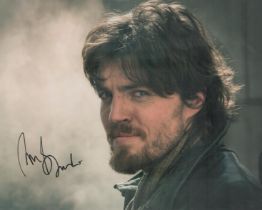 Tom Burke signed colour photo 10x8 Inch. He is best known for his roles as Athos in the 2014-2016