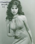 James Bond Miss Caruso actor Madeline Smith signed sexy 10 x 8 inch b/w photo with gun in hand.