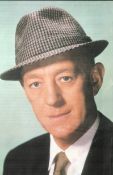 Alec Guinness signed 7 x 5 inch colour Magazine picture, signed in pink across collar bottom RH.