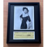Ava Gardner framed signed cheque for $100.00 Dated June 65 and black and white photo of Ava above.