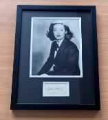 Bette Davis signed framed black and white photo with signature below. Measures 17"x13" appx. Good