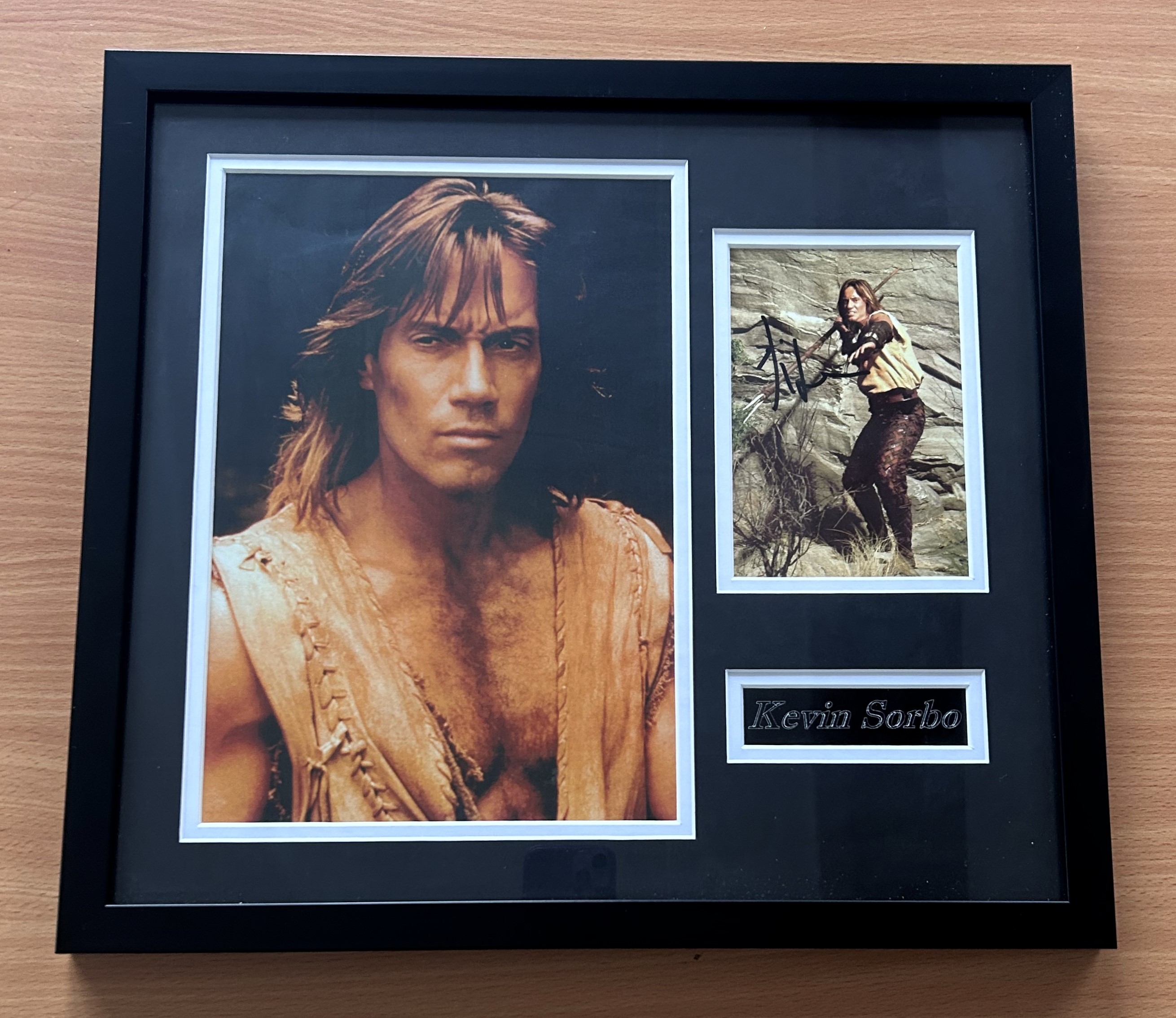 Kevin Sorbo signed frame 2 colour photos, 1 signed and name plaque. Measures 15"x17" appx. Good