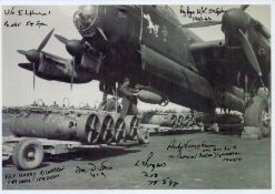 A Lancaster on the ground being loaded with Bombs, Black and White Photo, Signed by 6 including