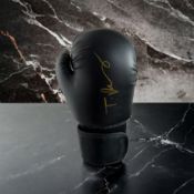 Tyson Fury signed black boxing glove. Tyson Luke Fury (born 12 August 1988) is a British