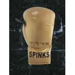 Michael Spinks signed golden boxing glove. Michael Spinks (born July 13, 1956) is an American former