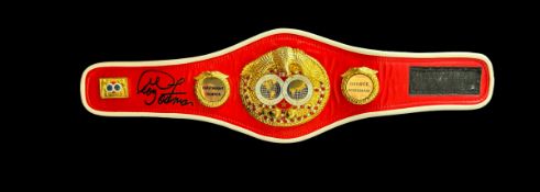 George Foreman signed mini IBF Heavyweight championship replica belt. Good condition. All autographs