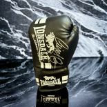 Nigel Benn and Chris Eubank signed black Lonsdale boxing glove. Nigel Gregory Benn (born 22