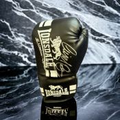 Nigel Benn and Chris Eubank signed black Lonsdale boxing glove. Nigel Gregory Benn (born 22